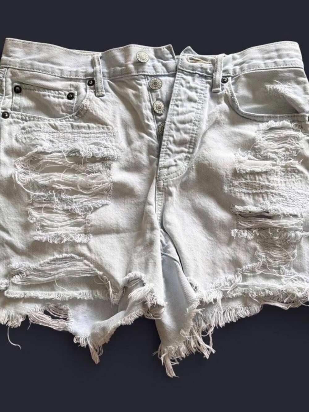 American Eagle white denim distressed jean shorts. Size 4